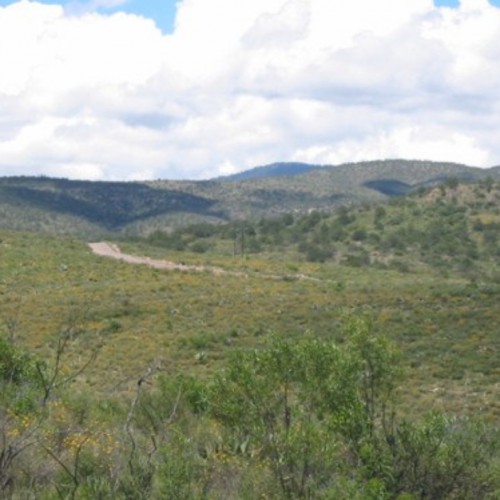 Central Colibri project landscape, moderate topography and paved roads passing through project area – view looking southwest